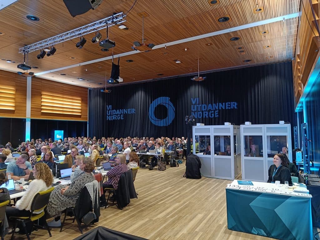 Interpreter booths in a conference hall at Thon Hotel Lillestrøm, with delegates at the tables